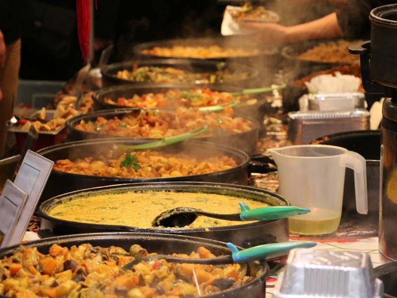 A picture of different curries in pans