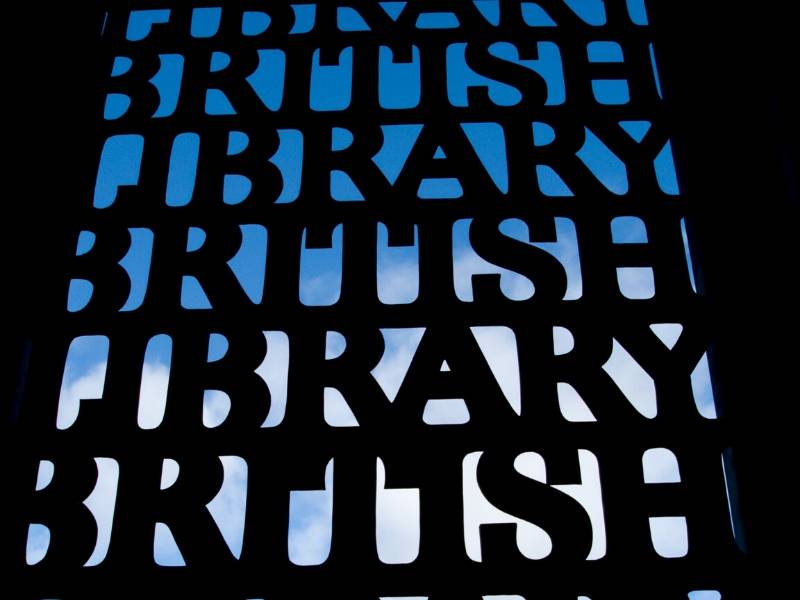 The words British Library on a grill with the sky behind