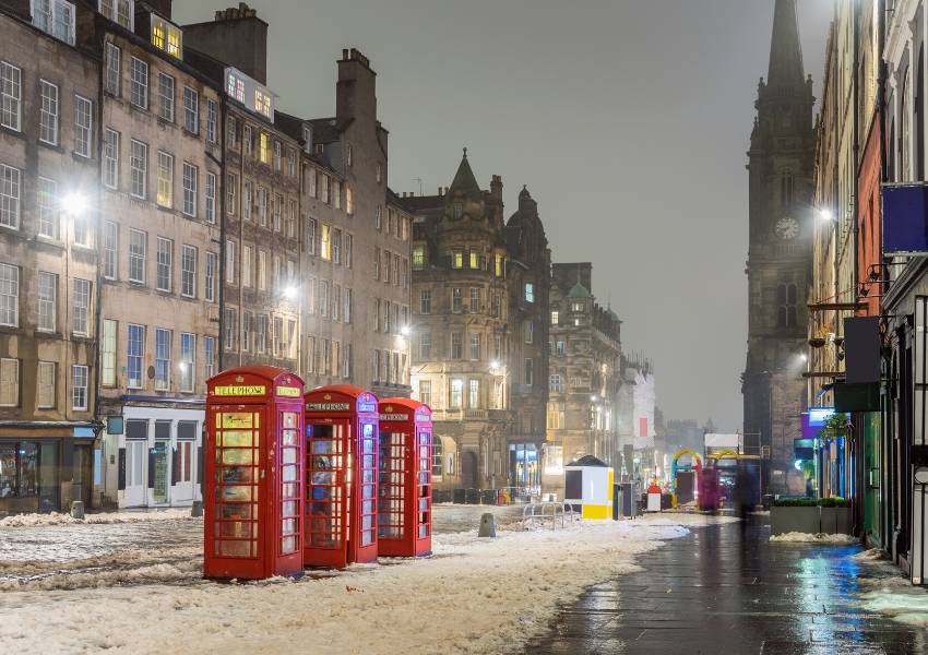 A snowy evening street scene in Edinburgh Scotland