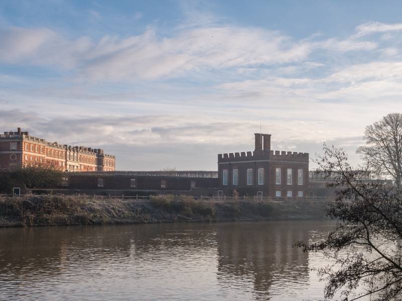 A picture of Hampton Court across a river