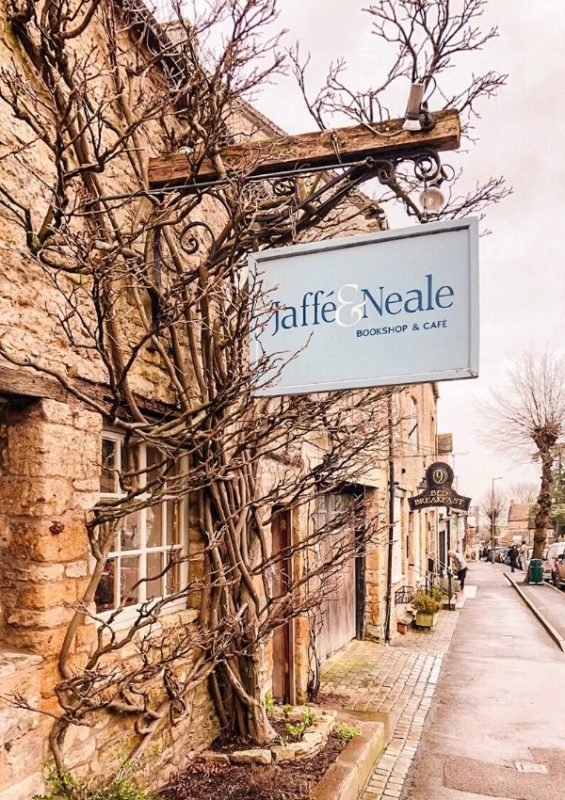 A picture of a bookshop and cafe sign in Stow on the Wold