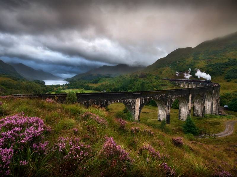 A steam train crosses the Glenfinnan viaduct.