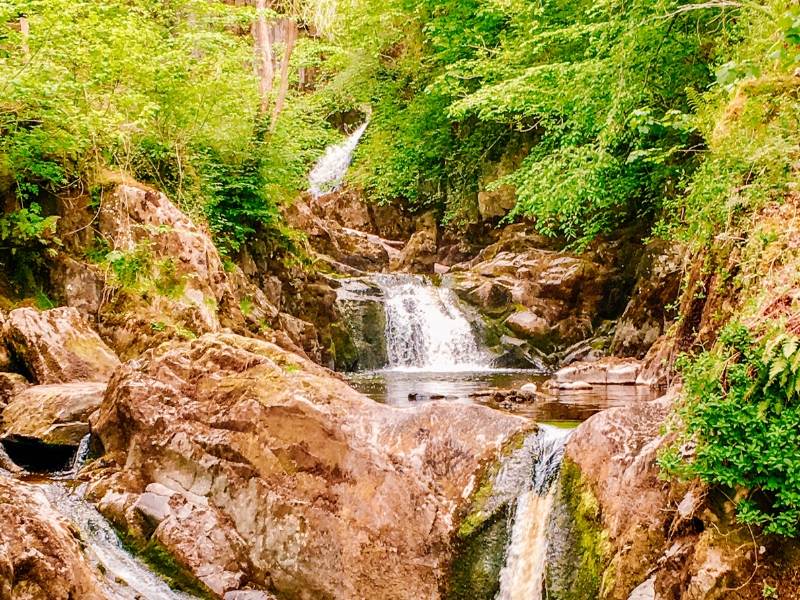 Waterfalls and lush green scenery