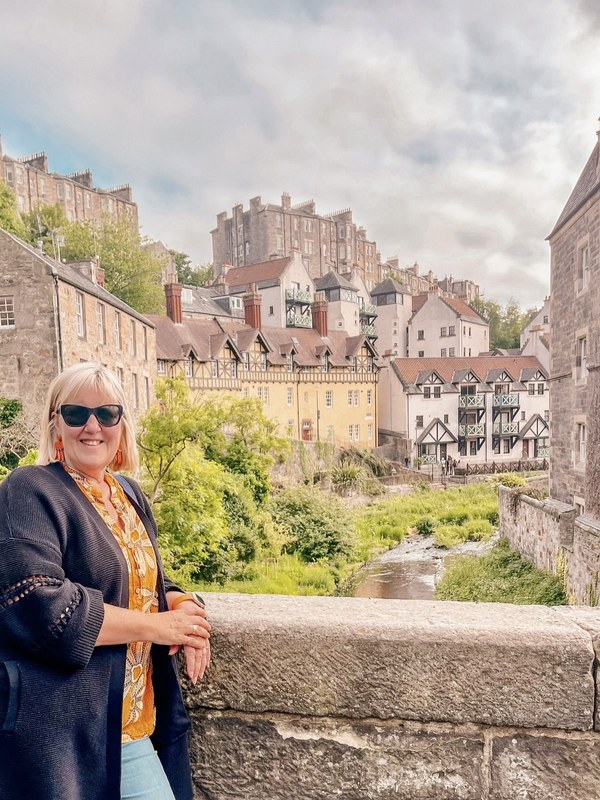 Tracy on the bridge at Dean Village, Edinburgh, looking towards Well Court and the Water of Leith