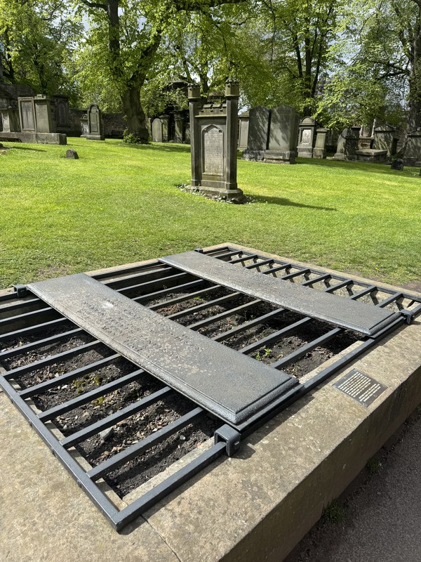 An iron mortsafe over a grave in Greyfriars Kirkyard, fitted to deter body snatchers