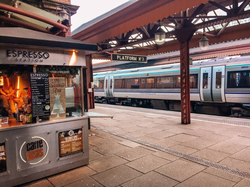 Train platform in the UK with a train at the station