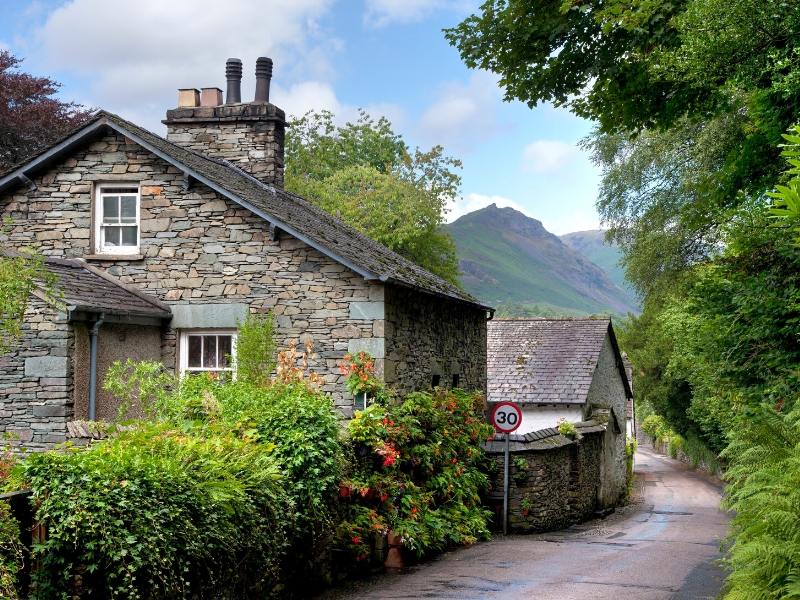 Stone houses in the village of Gresmere one of 24 pretty towns and villages in the Lake District to visit