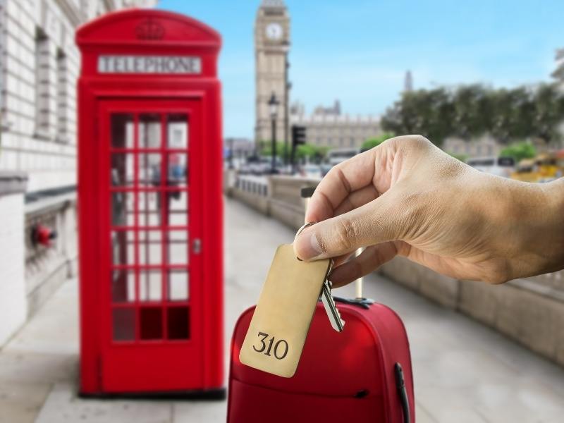 A London phone box, a red suitcase and a hotel room key