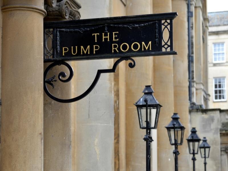 Sign for the Pump Rooms in Bath a popular attraction in Bath England