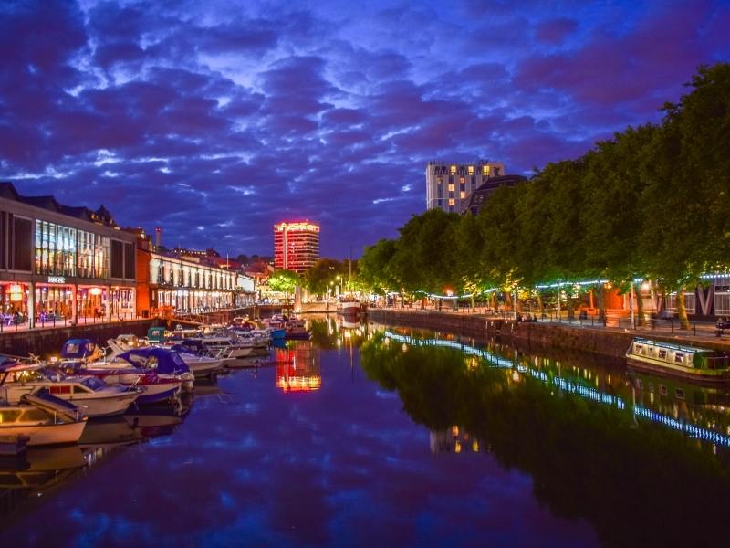 Bristol Travel Guide with views at night of boats on the river.
