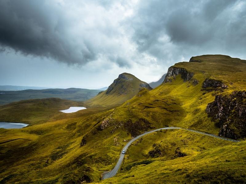 Driving in Scotland on beautiful country roads is one reason to consider renting a car in the UK.