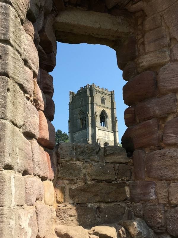 Fountains Abbey through a window in the ruins