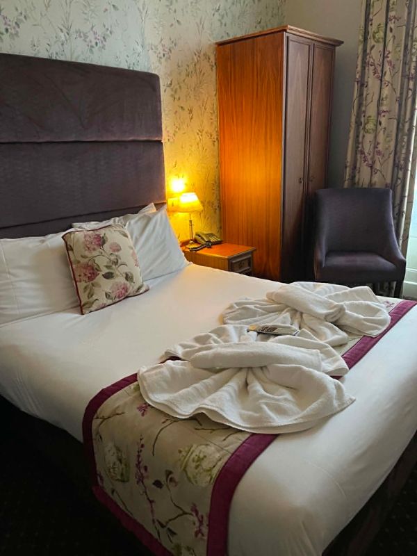Double bed with dressing gowns laid out at The Minster Hotel, York