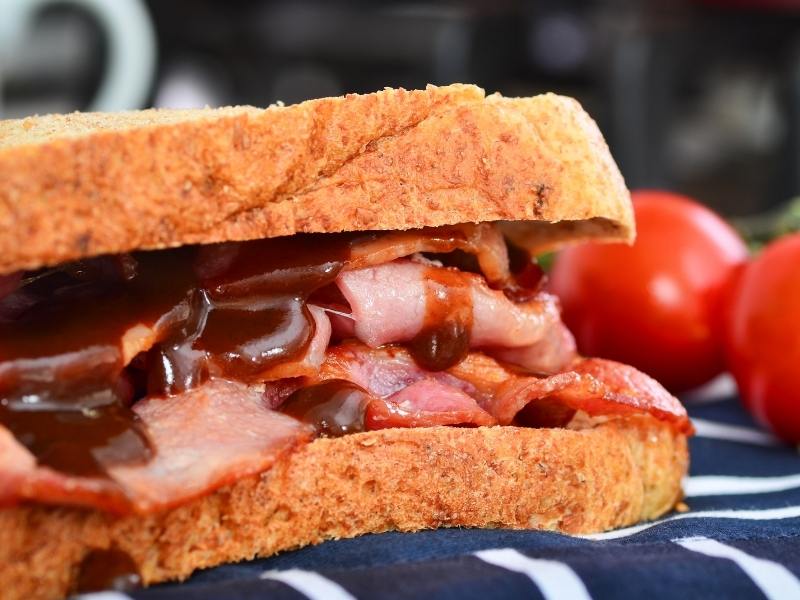 Bacon sandwich with brown sauce.