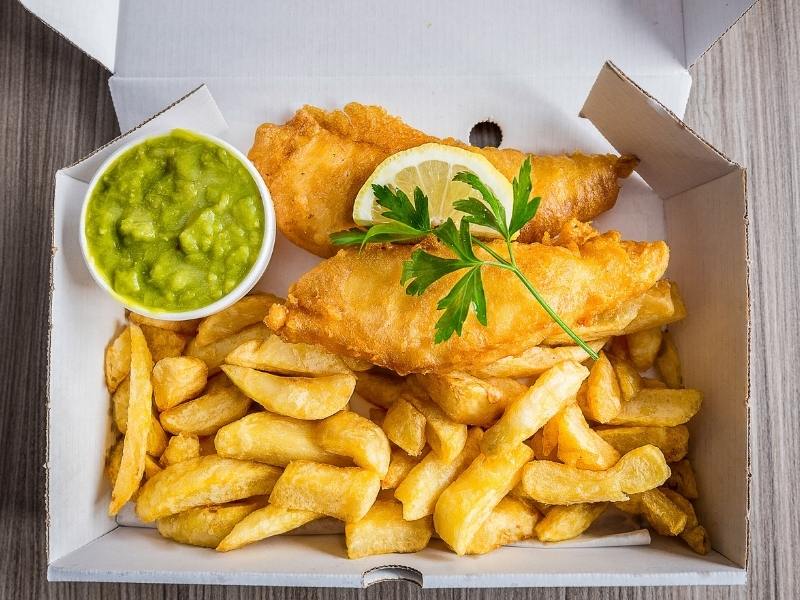 Fish and chips with mushy peas is one of the most popular traditional British foods.