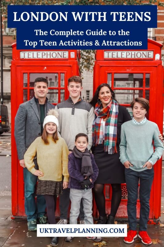 London with teens and kids - a family posing in front  of a London phone box.