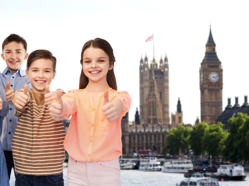 London with kids enjoying views of the Houses of Parliament.