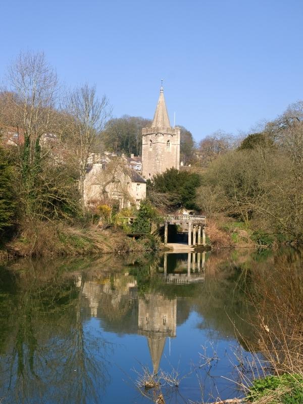 a church next to a river