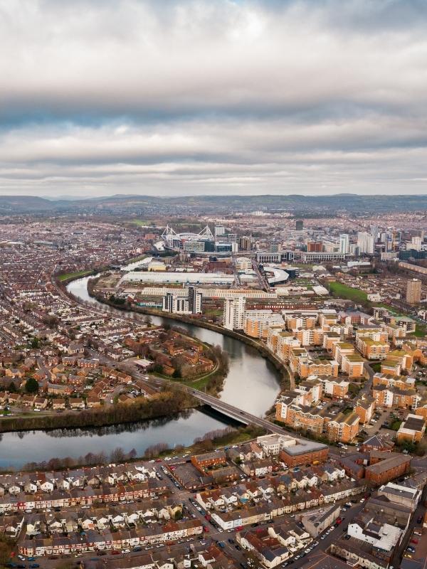 an aerial view of a city with a river