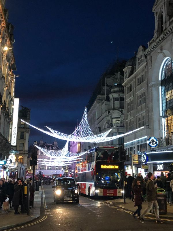 Christmas in London with Christmas lights on a street as described in episode 23 of the Uk Travel planning podcast.