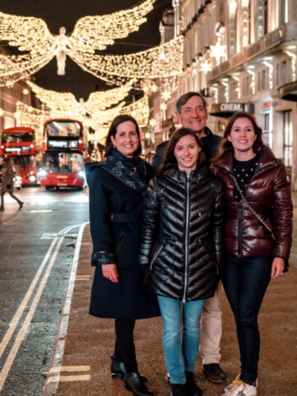Picture of a family on Regent Street in London at Christmas.