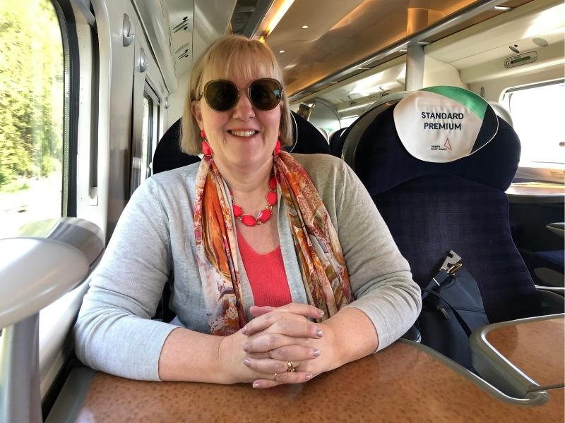 Lady sitting on a train in the UK.