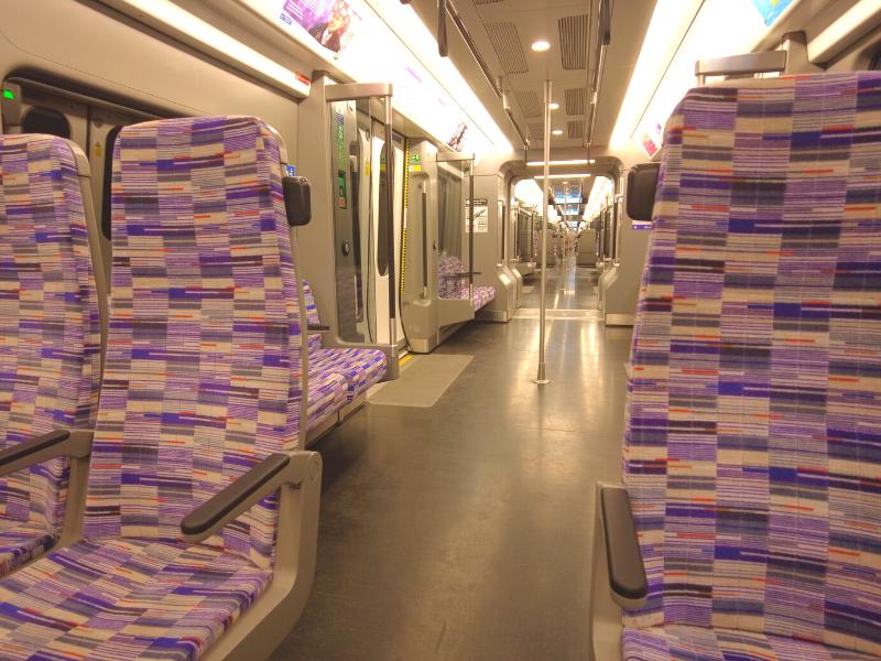 Elizabeth Line train with its distinctive purple colour is one way to travel London as recommended in episode 24 of the UK Travel planning podcast.