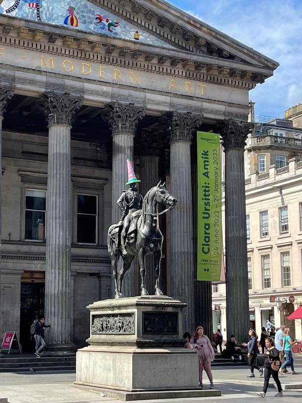 Gallery of Modern Art and the Duke of Wellington Statue with his hat on.