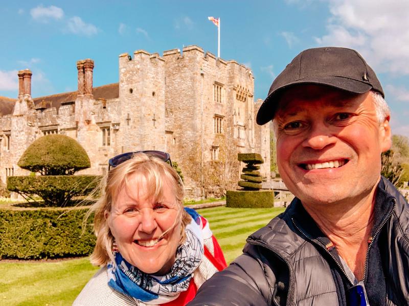 Two people standing in front of Hever castle.