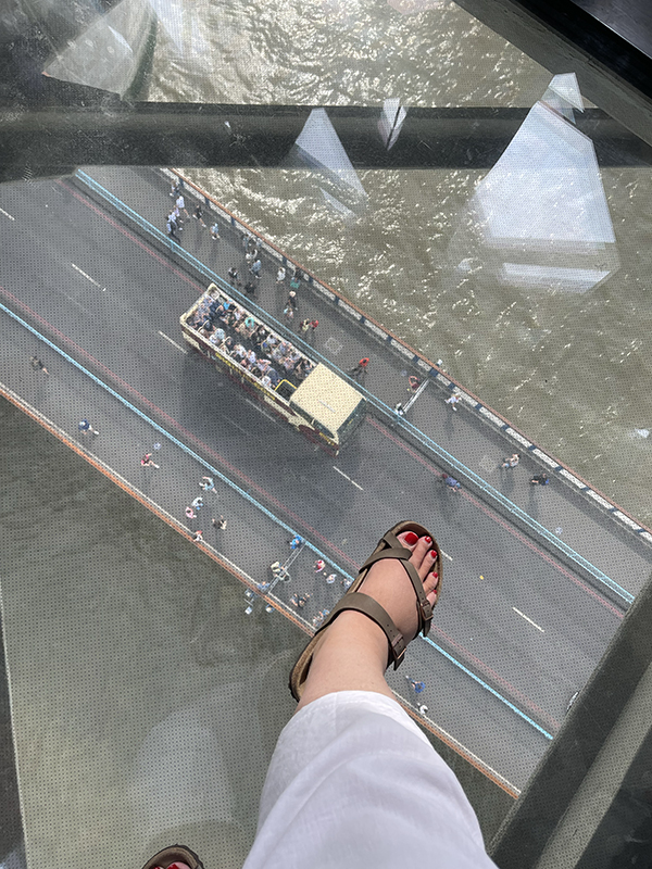 Standing on the glass floor at Tower Bridge