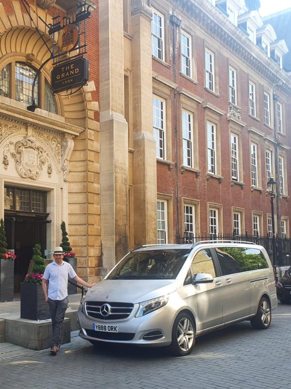 In episode 64 of the UK Travel Planning Podcast Tracy is joined by guest Andy Ward, the founder of Expedition Yorkshire who stands with his Mercedes van in this image.