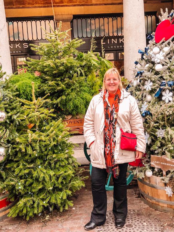 Episode 71 of the UK Travel Planning Podcast includes information about the best places to visit in London at Christmas like Covent Garden in the image.