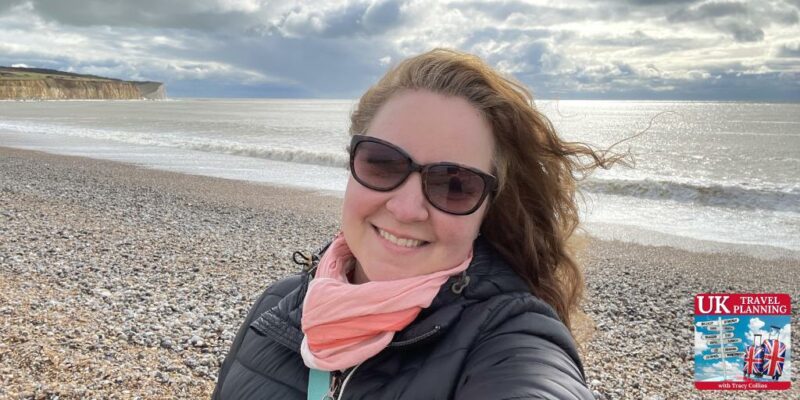 a woman taking a selfie on a beach