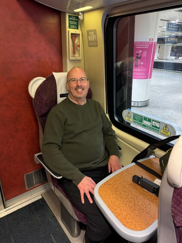 Man sitting on a train.