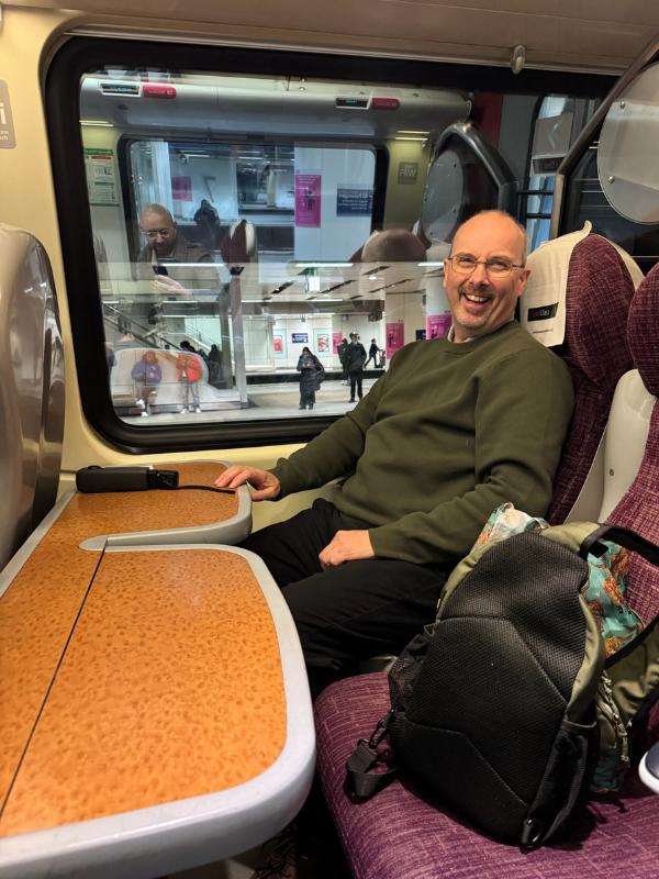 Man sitting on train.