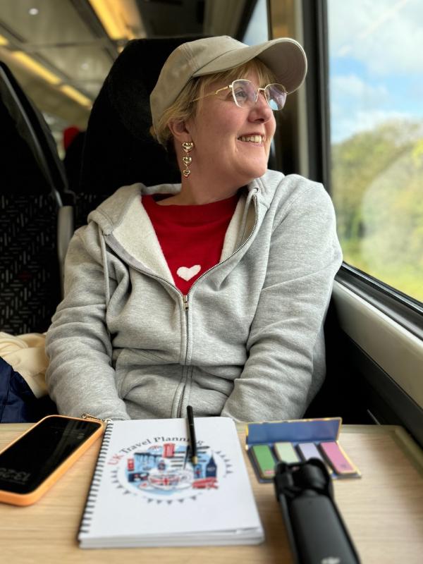 Tracy Collins on a train