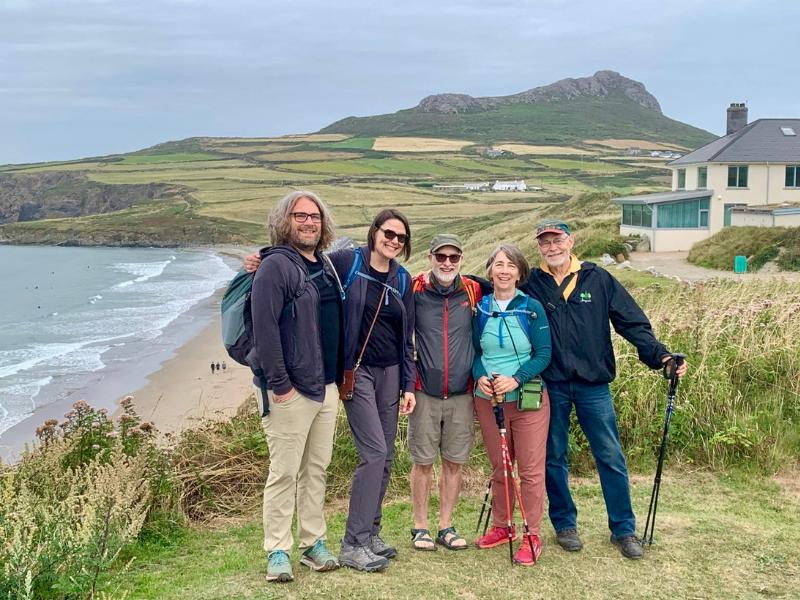 a group of walkers on the welsh coast as chatted about in episode 177 of the UK Travel Planning Podcast.