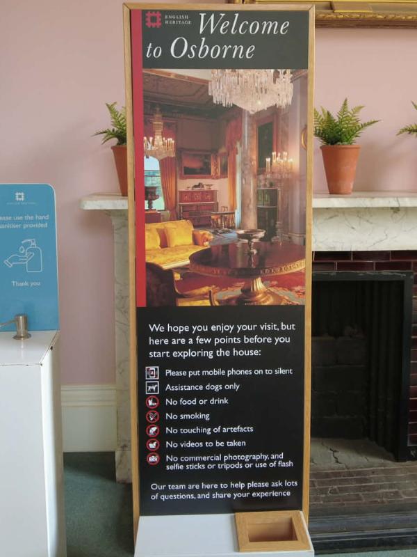 Accessible travel UK — English Heritage welcome sign at Osborne House historic site showing visitor information including assistance dogs policy