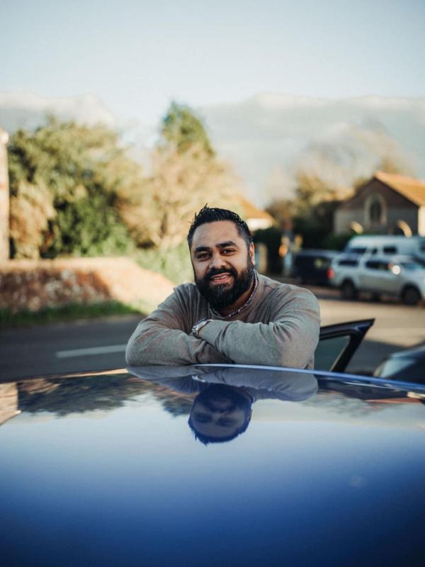 Riz of XFA Cars beside his private transfer vehicle