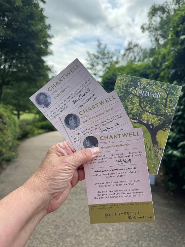 Timed entry cards for Chartwell, Winston Churchill's home in Kent, held on the garden path
