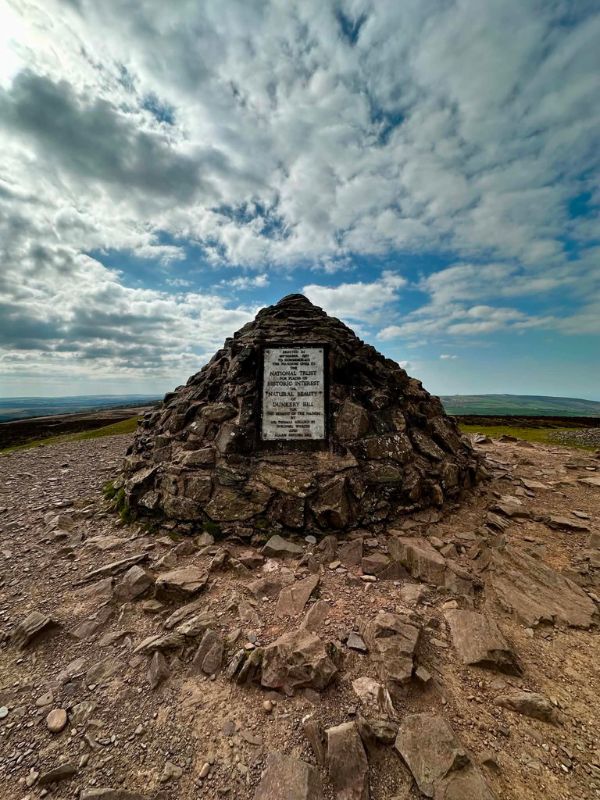 The stone cairn marking the summit of Dunkery Beacon on Exmoor