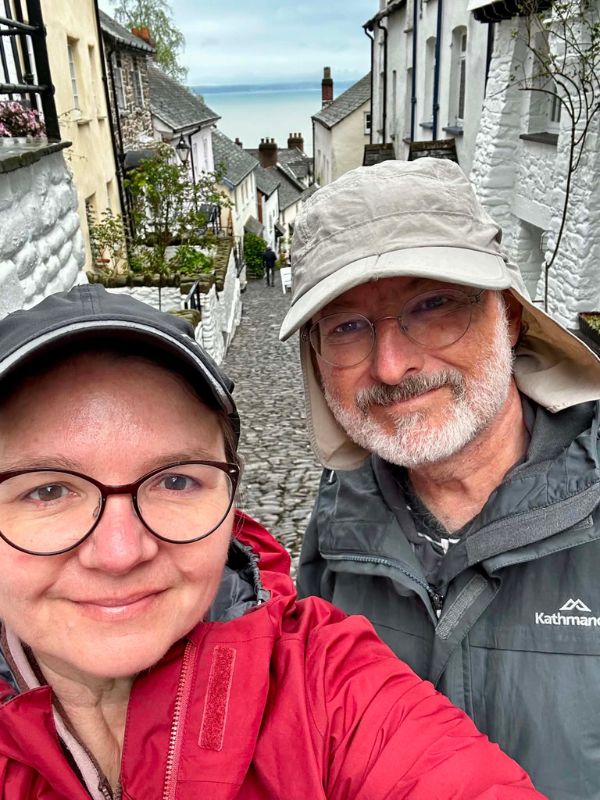 Katherine and Glen taking a selfie on the steep cobbled street of Clovelly