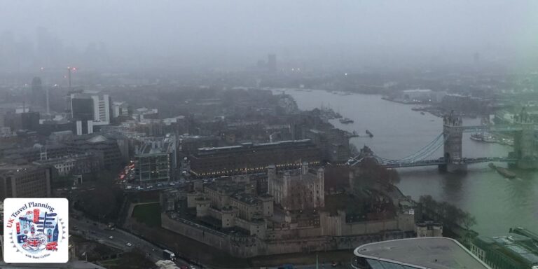 View of Tower Bridge on a grey, rainy, misty day in December from the Sky Garden