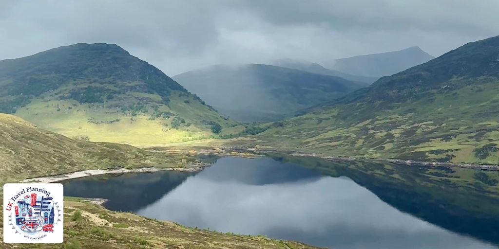 View of a loch and mountains in the mist on the West Highland Line in Scotland