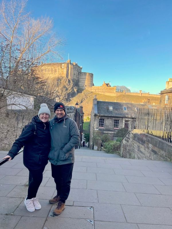 Tracy and Doug on the Vennel steps with Edinburgh Castle behind them